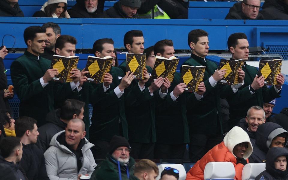 Actors are seen performing at half time in the stands as part of a promotion for the film Argylle