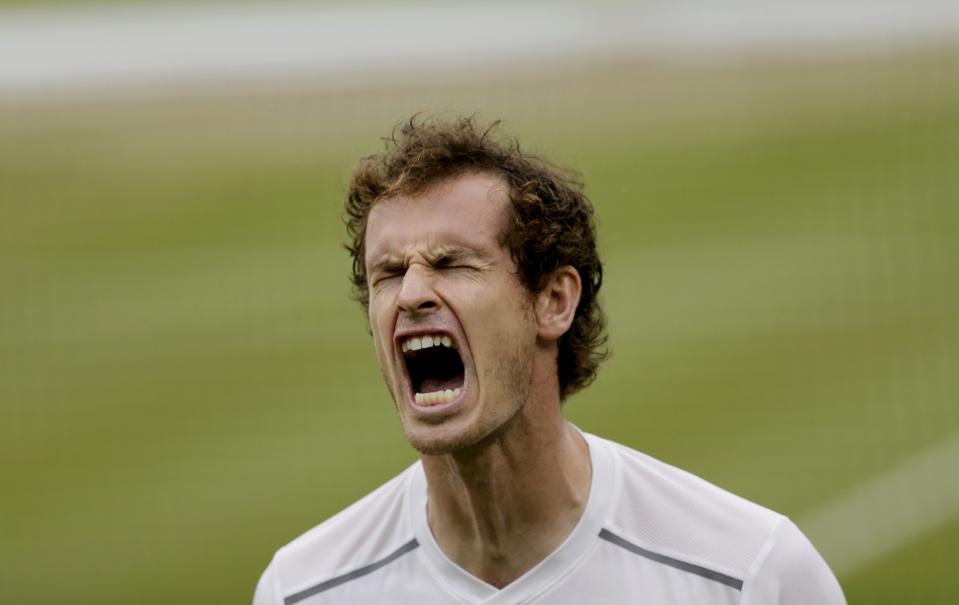 Andy Murray of Britain reacts during his match against Vasek Pospisil of Canada at the Wimbledon Tennis Championships in London, July 8, 2015. REUTERS/Henry Browne