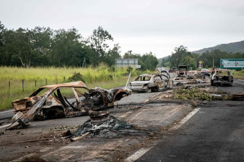 Burnt vehicles can be seen at an independantist roadblock at La Tamoa. The capital of the French Pacific territory of New Caledonia was rocked by riots after France's National Assembly approved contentious voting reforms to the territory that angered independence supporters. Delphine Mayeur/AFP/dpa