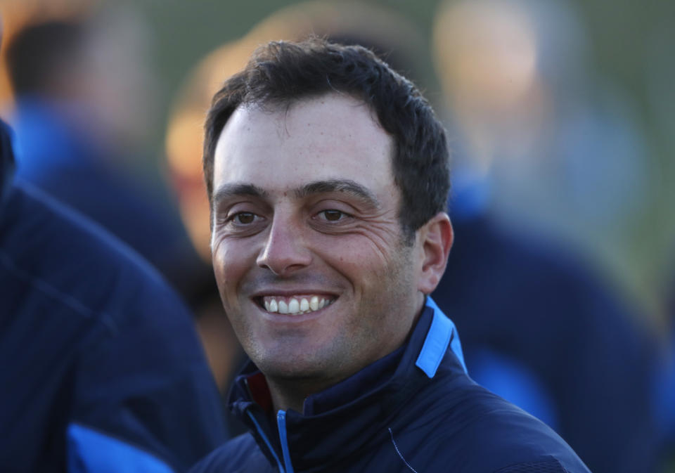 Europe's Francesco Molinari smiles as he prepares for the European Ryder Cup team photo at Le Golf National in Guyancourt, outside Paris, France, Tuesday, Sept. 25, 2018. The 42nd Ryder Cup will be held in France from Sept. 28-30, 2018 at Le Golf National. (AP Photo/Alastair Grant)