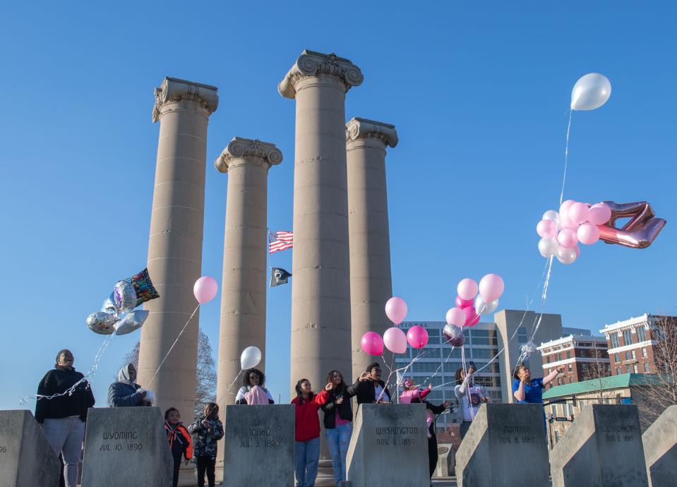 The family of Dawnita Wilkerson releases balloons at the Four Freedoms Monument in honor of her birthday on Tuesday, March 14, 2023. “She has a very close-knit family,” says Faye Cardin, Wilkerson’s aunt. “We like to celebrate each other’s birthdays. . .whenever we’re together, it’s always going to be 20 - 30 people. Cardin is joined by Wilkerson’s daughters and granddaughter, cousins, aunts, and uncles in observation of her birthday when she would be turning 47 years old.