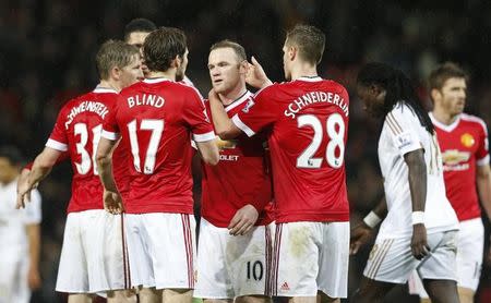 Football Soccer - Manchester United v Swansea City - Barclays Premier League - Old Trafford - 2/1/16 Manchester United's Wayne Rooney celebrates with team mates at the end of the match Action Images via Reuters / Carl Recine Livepic