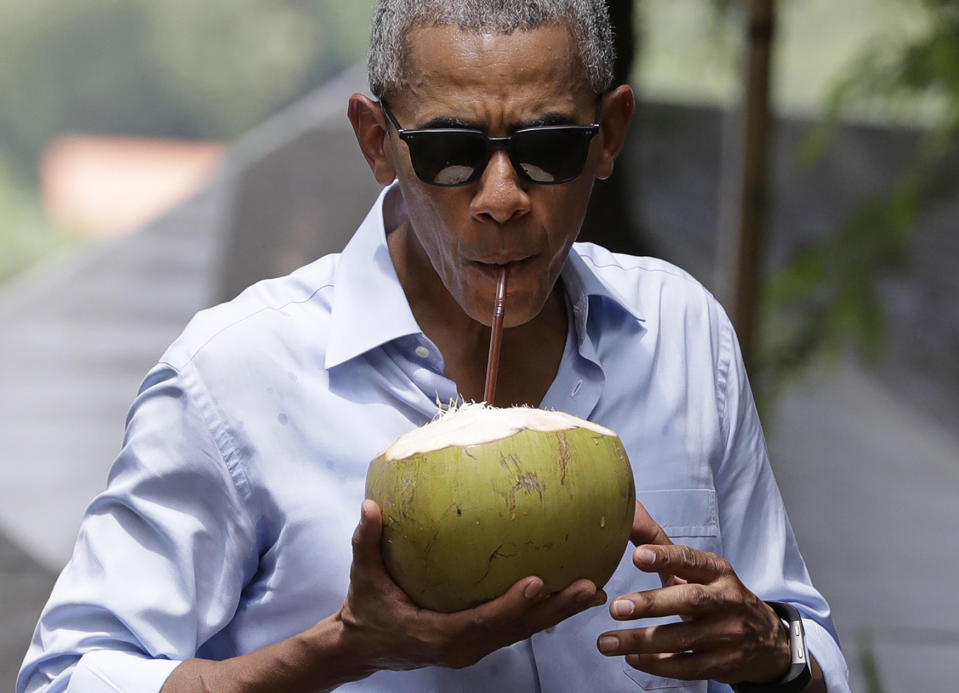President Obama drinks from a fresh coconut