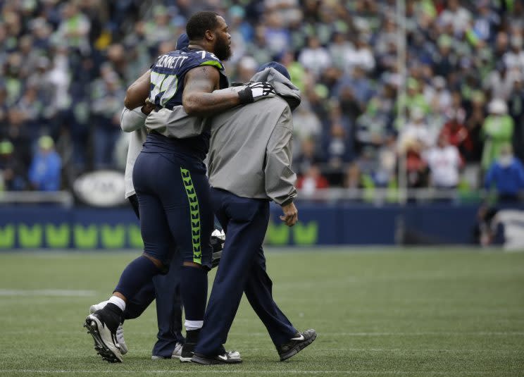 Michael Bennett was not pleased with a cut block that injured his knee (AP)