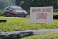 A sign calling for the saving of the Henry County Medical Center obstetric unit is displayed in a yard in Paris, Tenn., on Tuesday, Aug. 29, 2023. Hospital CEO John Tucker said lack of money was the main reason for closing the hospital's obstetric unit, and it was a necessary step toward saving the entire facility, which has been struggling financially for a decade. (AP Photo/Mark Humphrey)