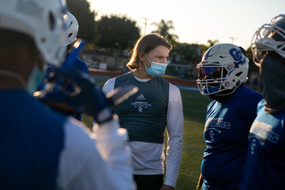 Feb. 26: Culver City High School starting quarterback Zevi Eckhausruns drills with the receivers during their first official football practice in Culver City, California, after the 11-month school shutdown. (Getty Images)