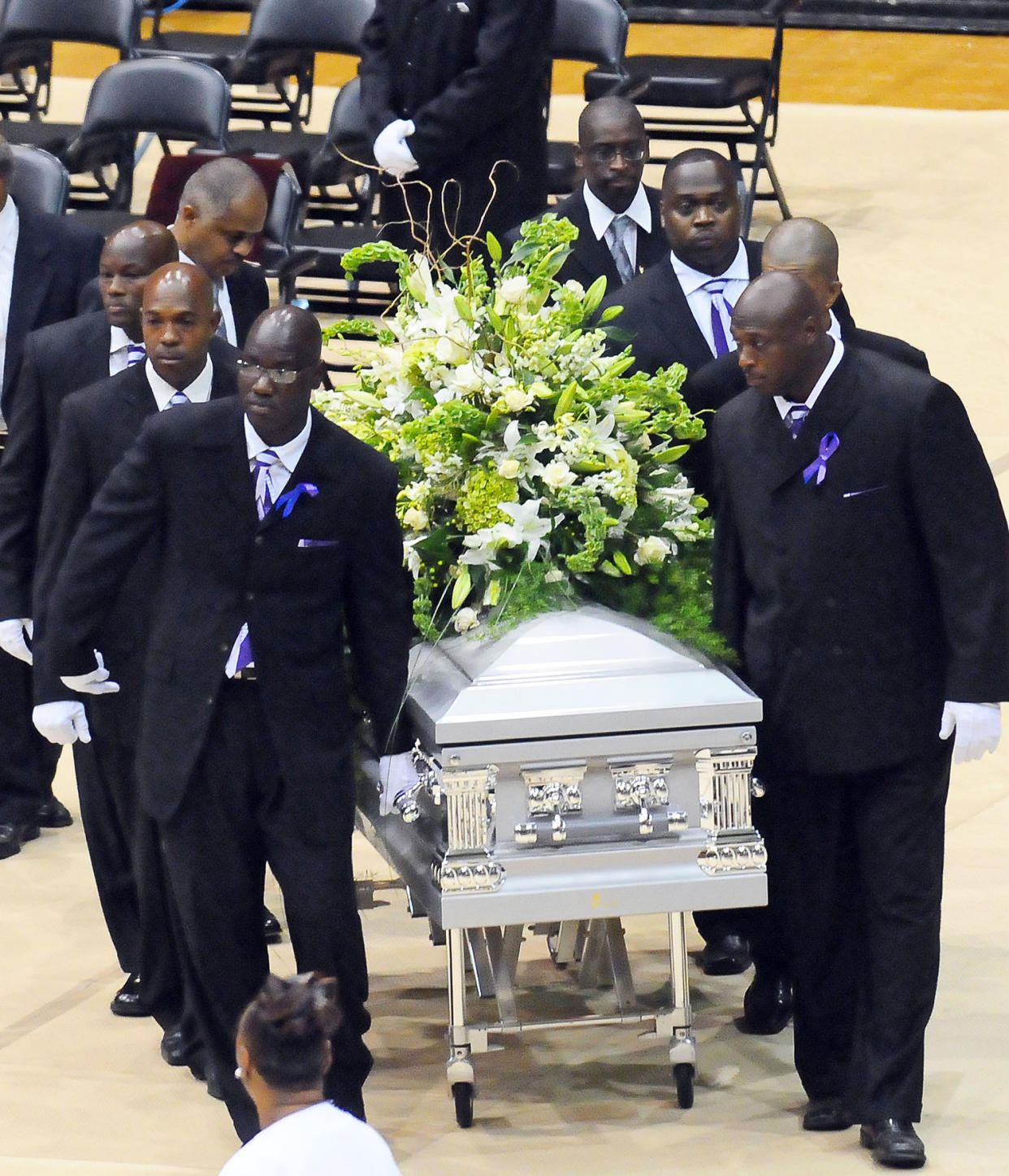 Pall bearers arrive with the casket for a funeral service for Steve McNair. (George Clark / Getty Images)