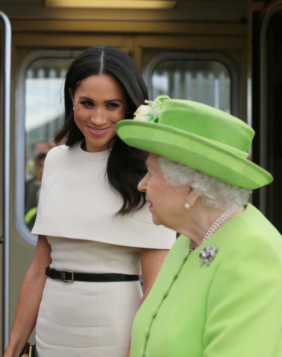 Queen Elizabeth II and the Duchess of Sussex arrive by Royal Train (PA)