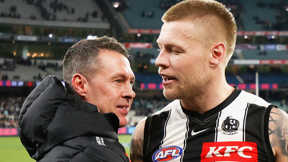 Jordan De Goey embraces Collingwood coach Craig McRae.