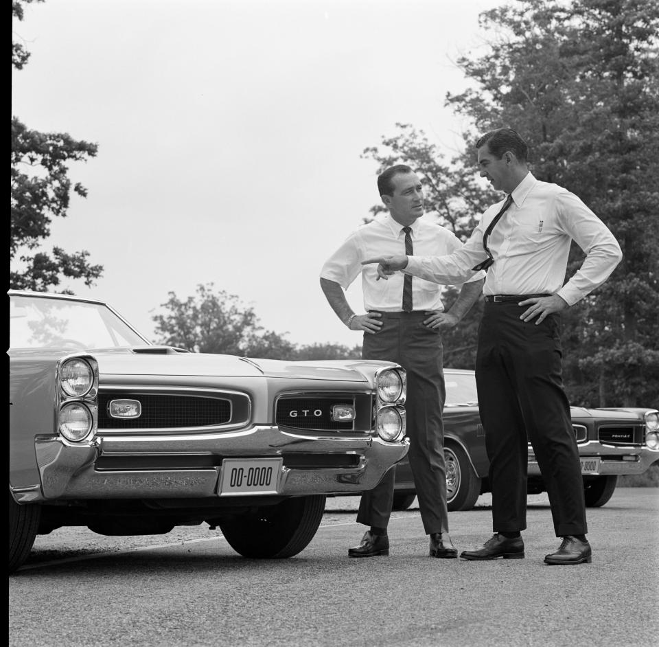 UNITED STATES - JULY 15:  1966 1966 Pontiac GTO. Car Craft Editorial Director Dick Day (left) speaks with Pontiac General Manager John Delorean about the 1966 GTO styling. (Photo by Bob D'Olivo/The Enthusiast Network via Getty Images/Getty Images)