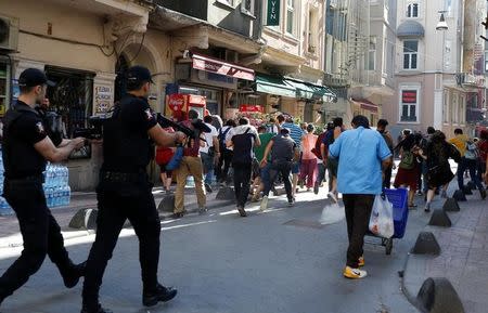 Riot police use rubber pellets to disperse LGBT rights activists as they try to gather for a pride parade, which was banned by the governorship, in central Istanbul, Turkey, June 25, 2017. REUTERS/Murad Sezer