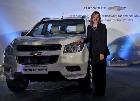 General Motors Chief Executive Officer Mary Barra poses next to the company's "Trailblazer" sports-utility vehicle during a news conference in New Delhi, July 29, 2015. "Trailblazer" will be launched in India this October. REUTERS/Anindito Mukherjee