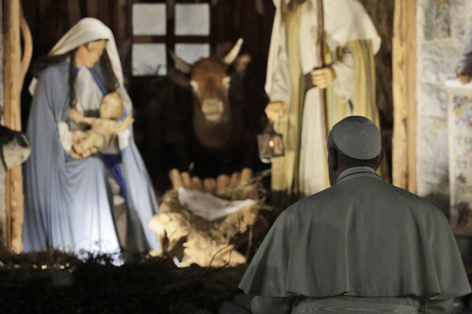 FILE - In this Dec. 31, 2019 file photo, Pope Francis stops by the Nativity exposed in St. Peter's square after presiding over vespers of the Feast of St. Mary and Te Deum of Thanksgiving at year's end, in St. Peter's Basilica at the Vatican. Pope Francis is giving his blessing to a new Vatican think tank that is seeking to prevent the Mafia and organized crime groups from exploiting the image of the Virgin Mary for their own illicit ends. (AP Photo/Gregorio Borgia)