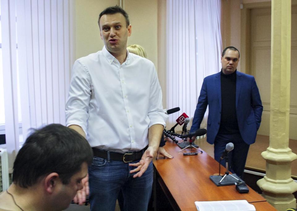 Russian opposition leader Alexei Navalny speaks in the court in Kirov, Russia, Wednesday, Feb. 8, 2017. A Russian court on Wednesday found opposition leader Alexei Navalny guilty in the retrial of a 2013 fraud case, which disqualifies him as a candidate for president next year. However, an associate said Navalny will carry on with the campaign he announced in December. (Sergei Shistarev/Komsomolskaya Pravda via AP)