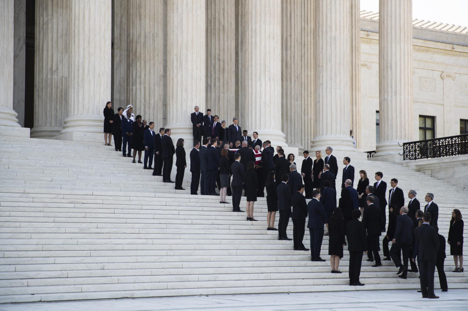 The casket of late Supreme Court Justice John Paul Stevens is carried into the U.S. Supreme Court in Washington, Monday, July 22, 2019. (AP Photo/Manuel Balce Ceneta)