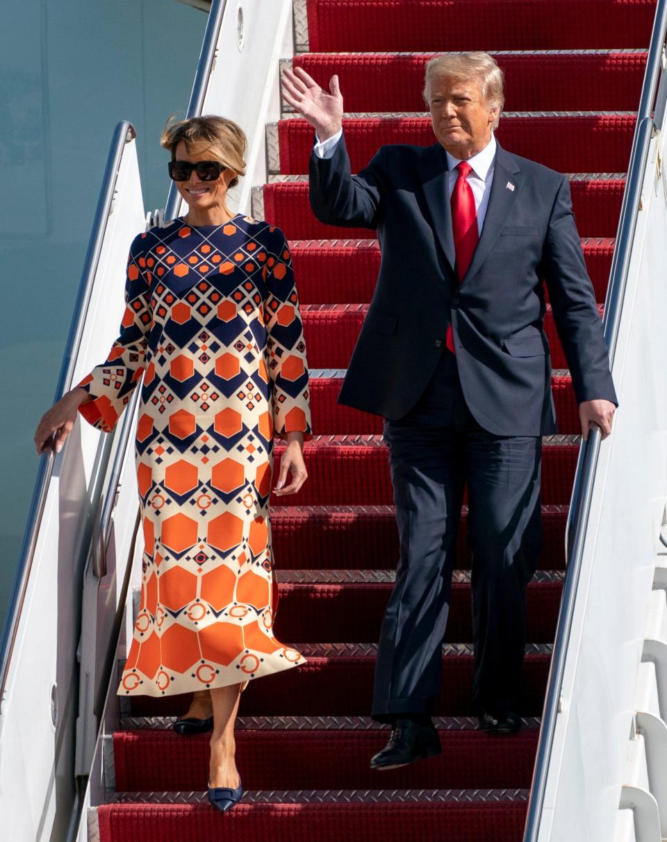 Former President Donald Trump and first lady Melania Trump are seen arriving at Palm Beach International Airport in West Palm Beach on January 20, 2021, the day of President Joe Biden's inauguration. Boxes of documents were reportedly on Air Force One that day as the former president arrived from Washington.