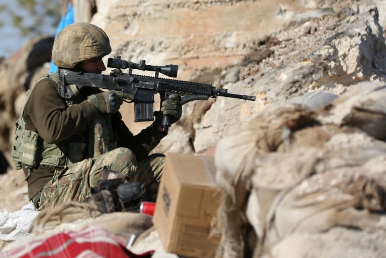 A Turkish soldier guards a position on Mount Bersaya, north of the Syrian town of Azaz near the border with Turkey, on January 29, 2018