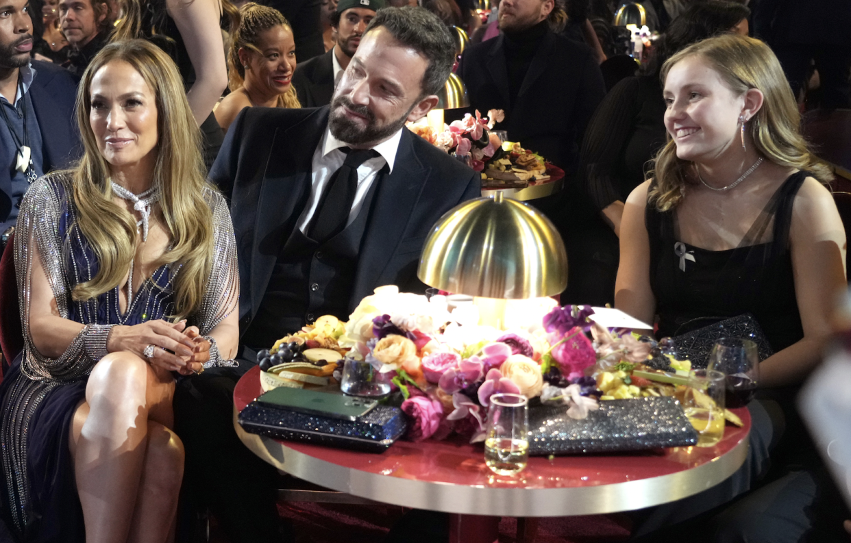 LOS ANGELES, CALIFORNIA - FEBRUARY 05: (L-R) Host Trevor Noah, Jennifer Lopez, and Ben Affleck attend the 65th GRAMMY Awards at Crypto.com Arena on February 05, 2023 in Los Angeles, California. (Photo by Kevin Mazur/Getty Images for The Recording Academy)
