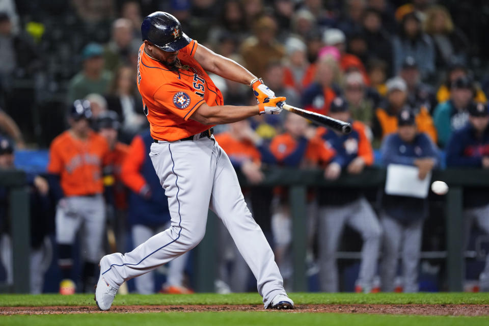 Houston Astros' Jose Abreu hits an RBI single against the Seattle Mariners during the seventh inning of a baseball game Wednesday, Sept. 27, 2023, in Seattle. (AP Photo/Lindsey Wasson)