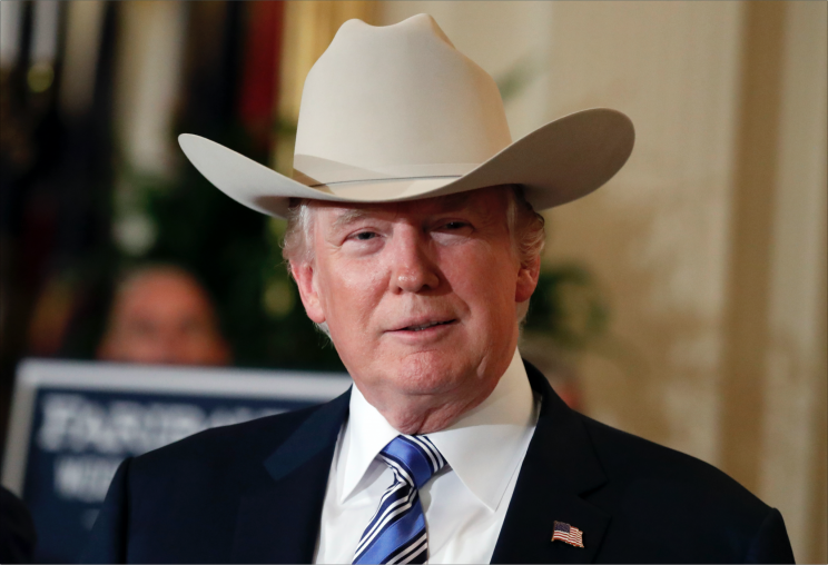 President Trump goes full cowboy. (Photo: AP Images)