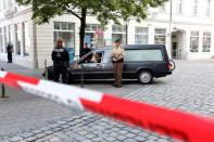 A hearse leaves the area after an explosion in Ansbach near Nuremberg, Germany, July 25, 2016. REUTERS/Michaela Rehle