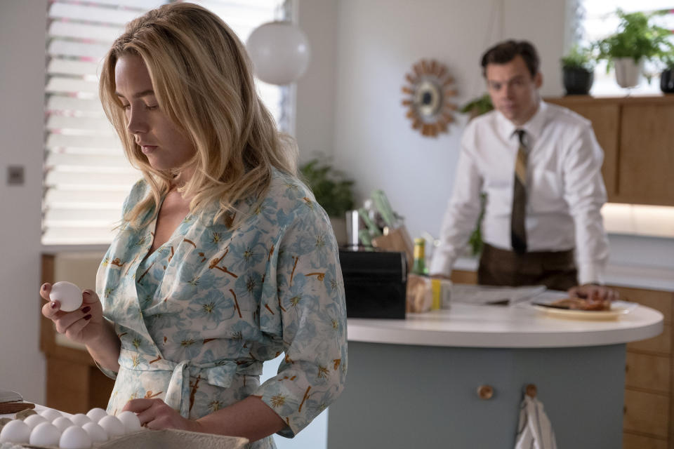 This image released by Warner Bros. Entertainment shows Florence Pugh, left, and Harry Styles in a scene from "Don't Worry Darling." (Warner Bros. Entertainment via AP)