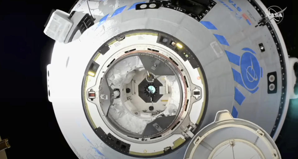 This image from NASA TV shows the Boeing Starliner preparing to dock at the International Space Station, Friday, May 20, 2022. Boeing's astronaut capsule has arrived at the International Space Station in a critical repeat test flight. Only a test dummy was aboard the capsule for Friday's docking, a huge achievement for Boeing after years of false starts. (NASA via AP)