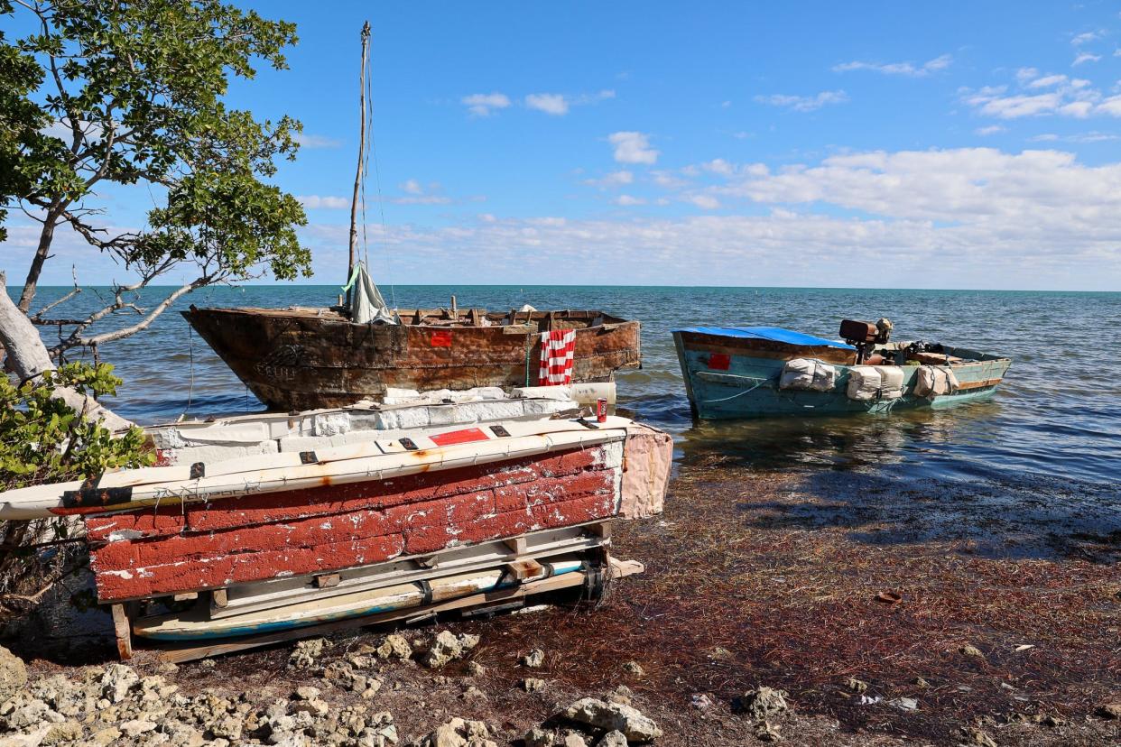 Abandoned migrant boats on the coastline of the Florida Keys.