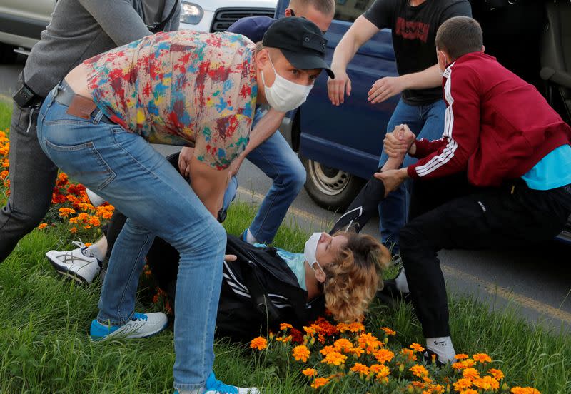 Law enforcement officers detain a participant of a protest after the Belarusian election commission refused to register Viktor Babariko and Valery Tsepkalo as candidates for the upcoming presidential election in Minsk