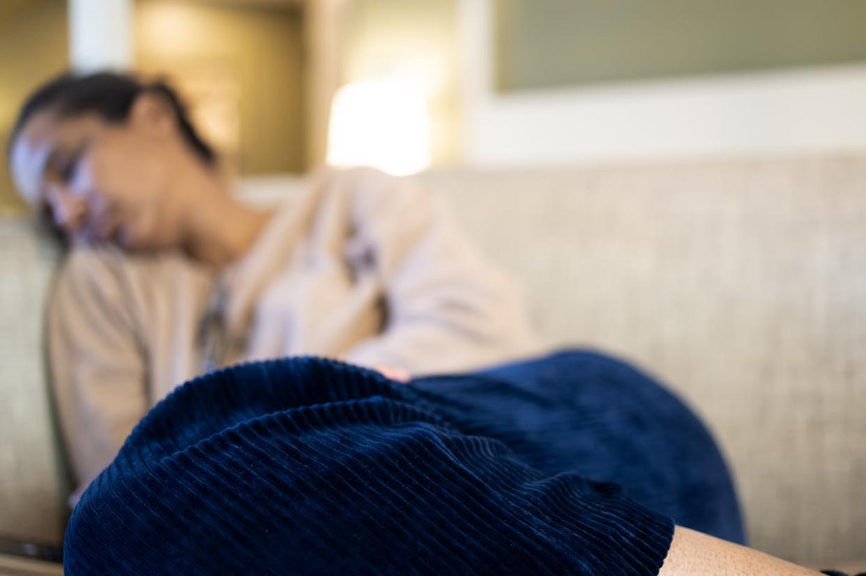 Researchers are gaining key insights into the ways that the SARS-CoV-2 virus can lead to long COVID symptoms. <a href="https://www.gettyimages.com/detail/photo/black-woman-napping-on-sofa-royalty-free-image/1466533965?phrase=long+covid&adppopup=true" rel="nofollow noopener" target="_blank" data-ylk="slk:Catherine McQueen/Moment via Getty Images;elm:context_link;itc:0;sec:content-canvas" class="link ">Catherine McQueen/Moment via Getty Images</a>