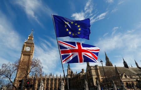 FILE PHOTO - EU and Union flags fly above Parliament Square during a Unite for Europe march, in central London, Britain March 25, 2017. REUTERS/Peter Nicholls/File Photo