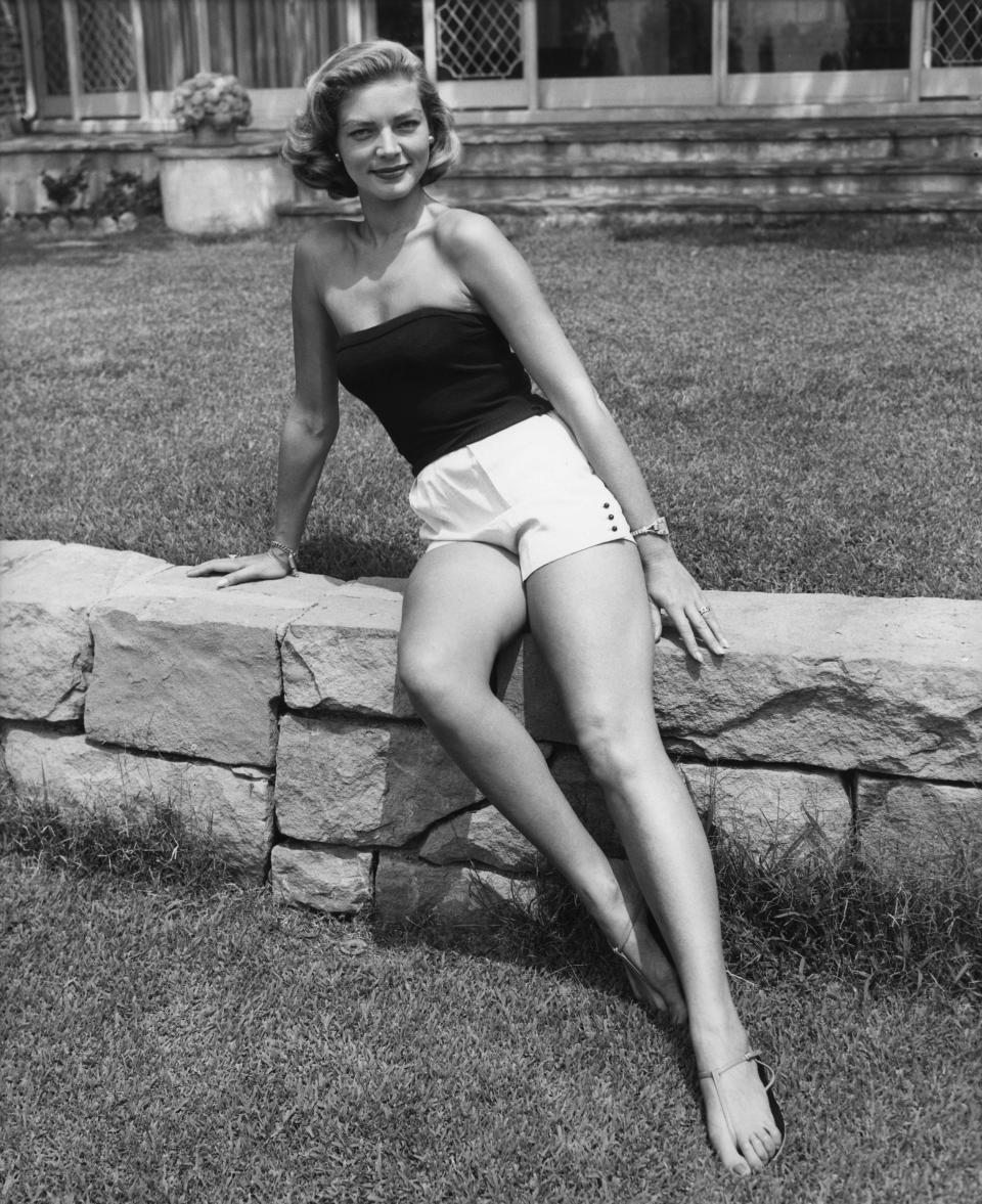 An undated photo of Bacall wearing a strapless top and white shorts.&nbsp;