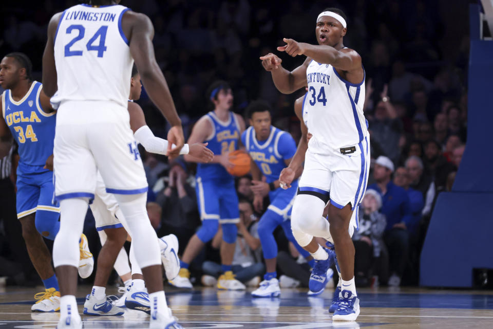 Kentucky forward Oscar Tshiebwe (34) reacts during the second half of an NCAA college basketball game against UCLA in the CBS Sports Classic, Saturday, Dec. 17, 2022, in New York. The Bruins won 63-53. (AP Photo/Julia Nikhinson)