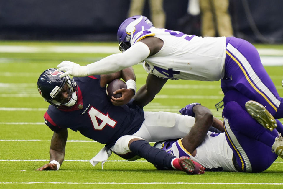 Houston Texans quarterback Deshaun Watson (4) is sacked by Minnesota Vikings defensive tackle Jaleel Johnson (94) during the second half of an NFL football game Sunday, Oct. 4, 2020, in Houston. (AP Photo/David J. Phillip)