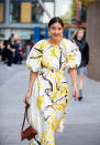 Bettina Looney is seen wearing yellow white dress with graphic print, brown bag outside Ports 1961. [Photo: Getty]