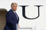 President Donald Trump pauses at the top of the steps of Air Force One at Andrews Air Force Base, Md., Friday, Sept. 18, 2020. Trump is heading to Minnesota for a campaign rally. (AP Photo/Susan Walsh)