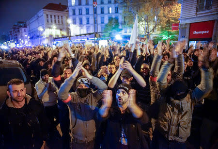 Several thousand police officers and firemen attend an unauthorised protest against anti-violence late in the night in Lyon, France, October 26, 2016. REUTERS/Robert Pratta