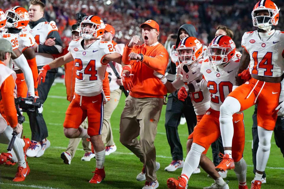 Clemson coach Dabo Swinney (center) will return to the TaxSlayer Gator Bowl, 14 years after he led the Tigers to Jacksonville in his first bowl game as their coach.