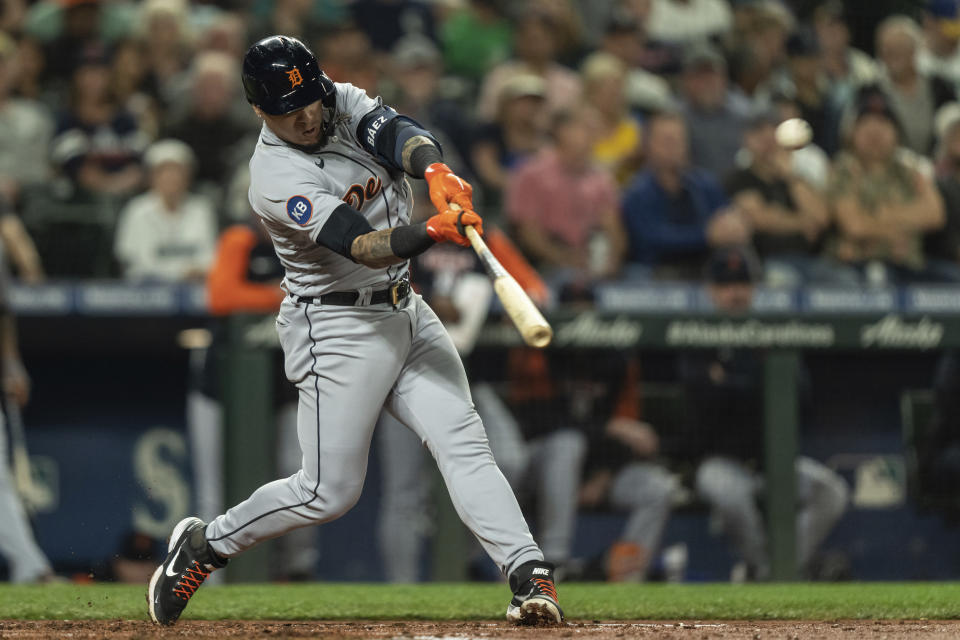 Detroit Tigers' Javier Baez hits a two-run home run off Seattle Mariners starting pitcher George Kirby during the third inning of a baseball game, Monday, Oct. 3, 2022, in Seattle. (AP Photo/Stephen Brashear)