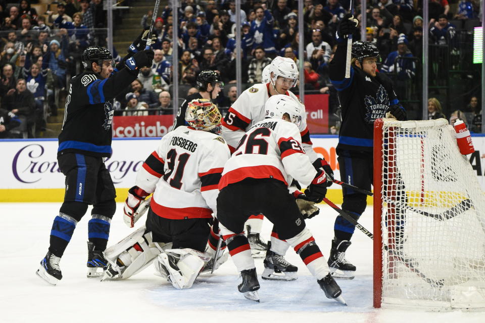 Toronto Maple Leafs forward William Nylander, right, celebrates after scoring on Ottawa Senators goaltender Anton Forsberg (31) during the second period of an NHL hockey game Friday, Jan. 27, 2023, in Toronto. (Christopher Katsarov/The Canadian Press via AP)