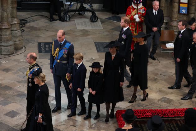 William, George, Charlotte and Kate walk in front of the Duke and Duchess of Sussex at the state funeral and burial of Queen Elizabeth. (Photo: PHIL NOBLE via Getty Images)