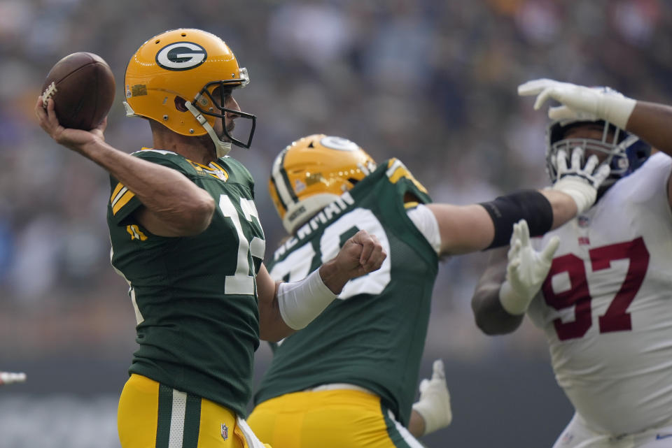 Green Bay Packers quarterback Aaron Rodgers (12) passes the ball during an NFL game between the New York Giants and the Green Bay Packers at the Tottenham Hotspur stadium in London, Sunday, Oct. 9, 2022. (AP Photo/Alastair Grant)