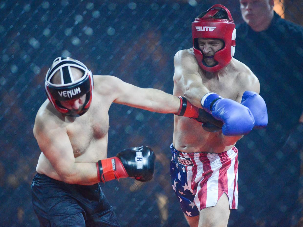 Keith Busby lands a shot on Alan Weatherford during the 2024 'Black Tie & Boxing' Charity Event inside Carl Perkins Civic Center in Jackson, Tenn., on Saturday, Jan. 13, 2024.