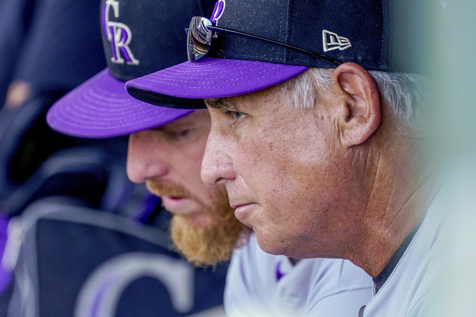 Colorado Rockies manager Bud Black, right, speaks with starting pitcher Jon Gray, left, in the dugout during the fifth inning of a baseball game against the Washington Nationals at Nationals Park, Sunday, Sept. 19, 2021, in Washington. (AP Photo/Andrew Harnik)