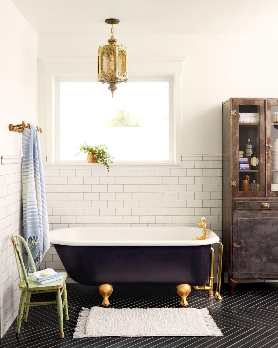 bathroom with black herringbone tile floor