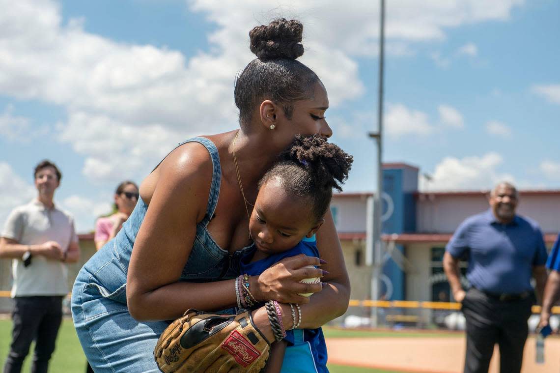 Actress Jennifer Hudson hugs 6-year-old SiMonne Jackson-Lenoir after warming up with kids from the Boys & Girls Clubs of Greater Kansas City on Tuesday.