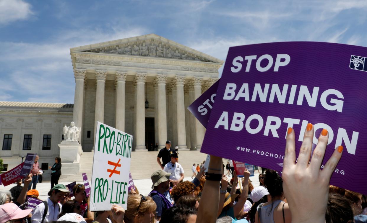 Abortion rights activists rally outside the US Supreme Court in Washington DC. (REUTERS)