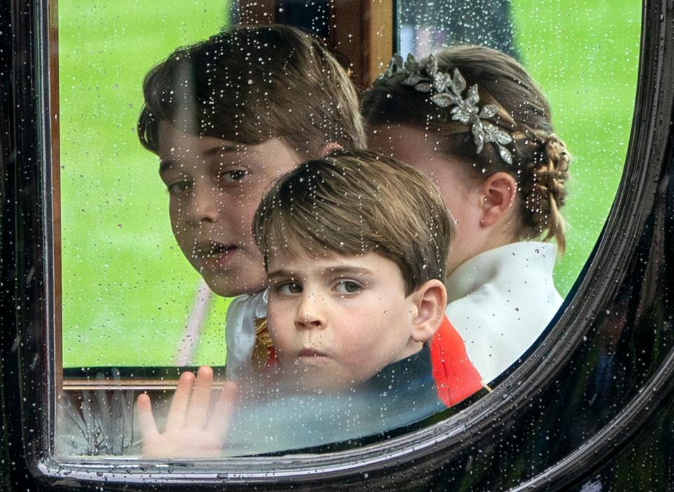 Britain's Prince Louis of Wales, Britain's Prince George of Wales and Britain's Princess Charlotte of Wales travel back to Buckingham Palace from Westminster Abbey in central London on May 6, 2023, after the coronations of Britain's King Charles III and Britain's Queen Camilla. - The set-piece coronation is the first in Britain in 70 years, and only the second in history to be televised. Charles will be the 40th reigning monarch to be crowned at the central London church since King William I in 1066. (Photo by Jane Barlow / POOL / AFP) (Photo by JANE BARLOW/POOL/AFP via Getty Images)