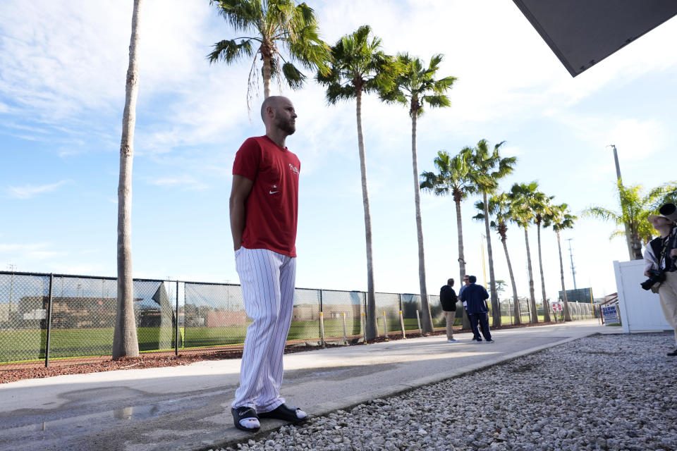 Philadelphia Phillies pitcher Zack Wheeler waits for a coffee before a baseball spring training workout Wednesday, Feb. 14, 2024, in Clearwater, Fla. (AP Photo/Charlie Neibergall)