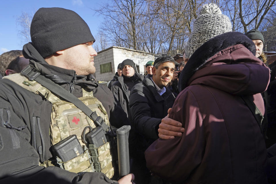 Prime Minister Rishi Sunak talks to members of the public in Kyiv, Ukraine, ahead of meeting with President Volodymyr Zelenskyy to announce a major new package of military aid to Ukraine, Friday, Jan. 12, 2024. (Stefan Rousseau/Pool via AP)